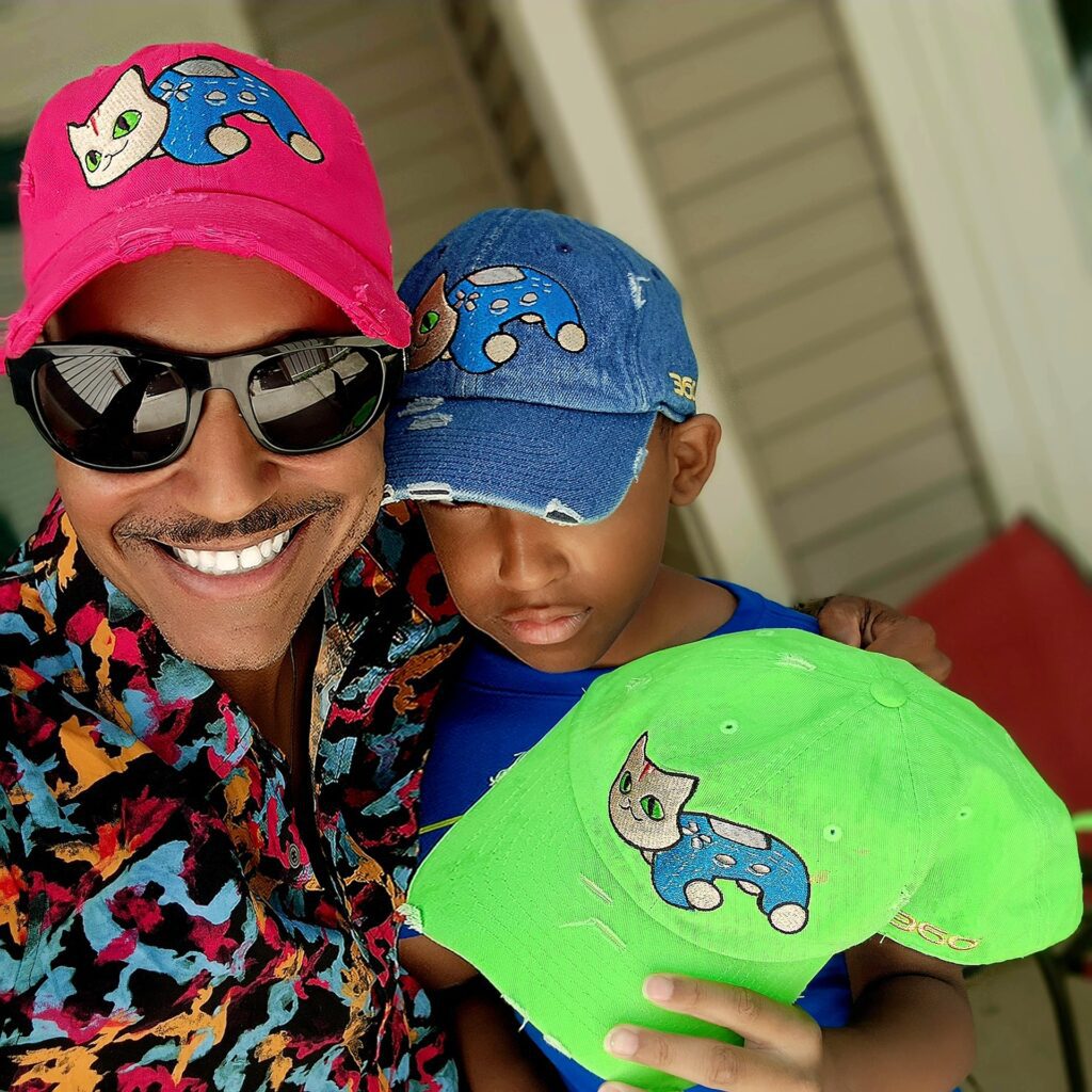 Vaughn Lowery and son rock their Lucky Lenox dad hats for 360 MAGAZINE NFT Animal Series