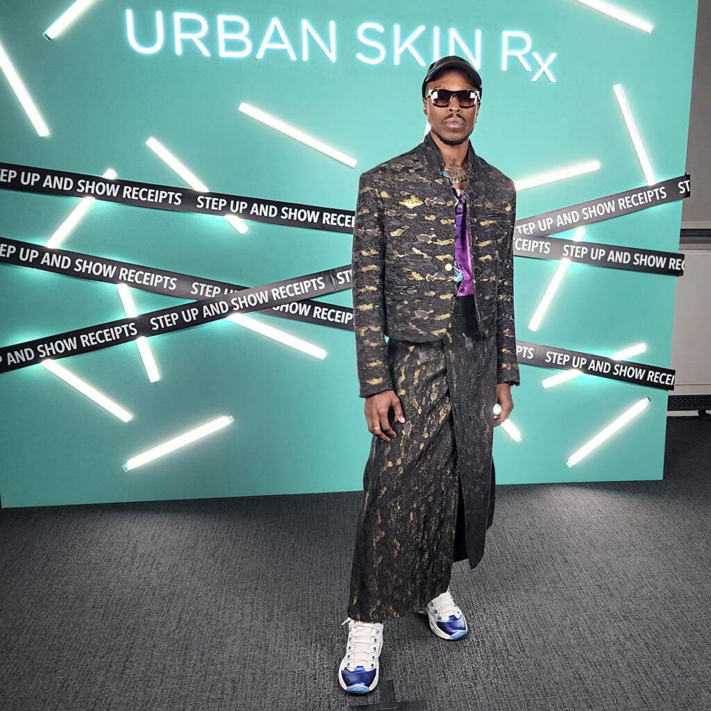Armon Hayes dressed in Terry Singh, mvmt shades, Reebok's Allen Iverson high tops at Fashion Bomb Daily designer showcase via 360 MAGAZINE