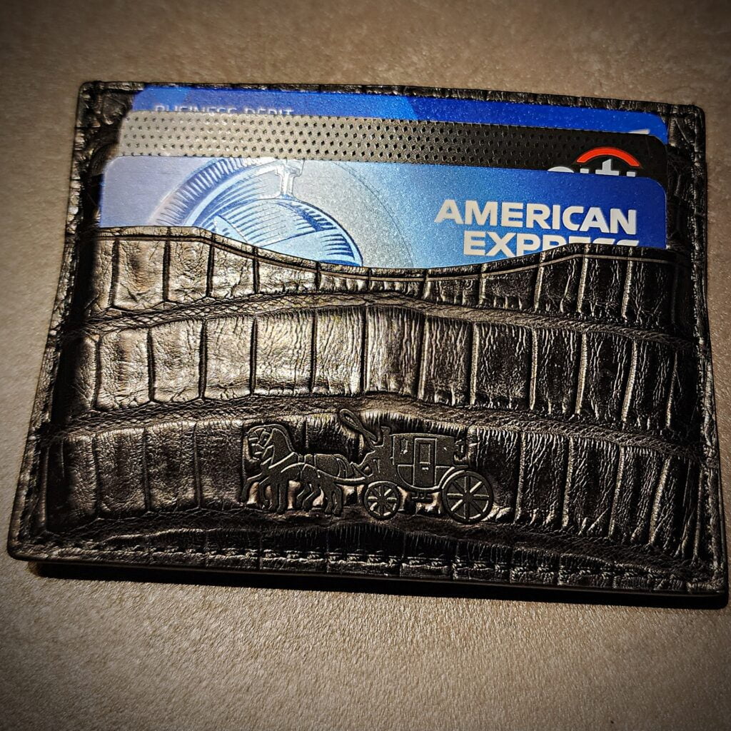 AMEX (inside crocodile coach men's wallet) and RESY promo at Art Basel in Miami via 360 MAGAZINE.