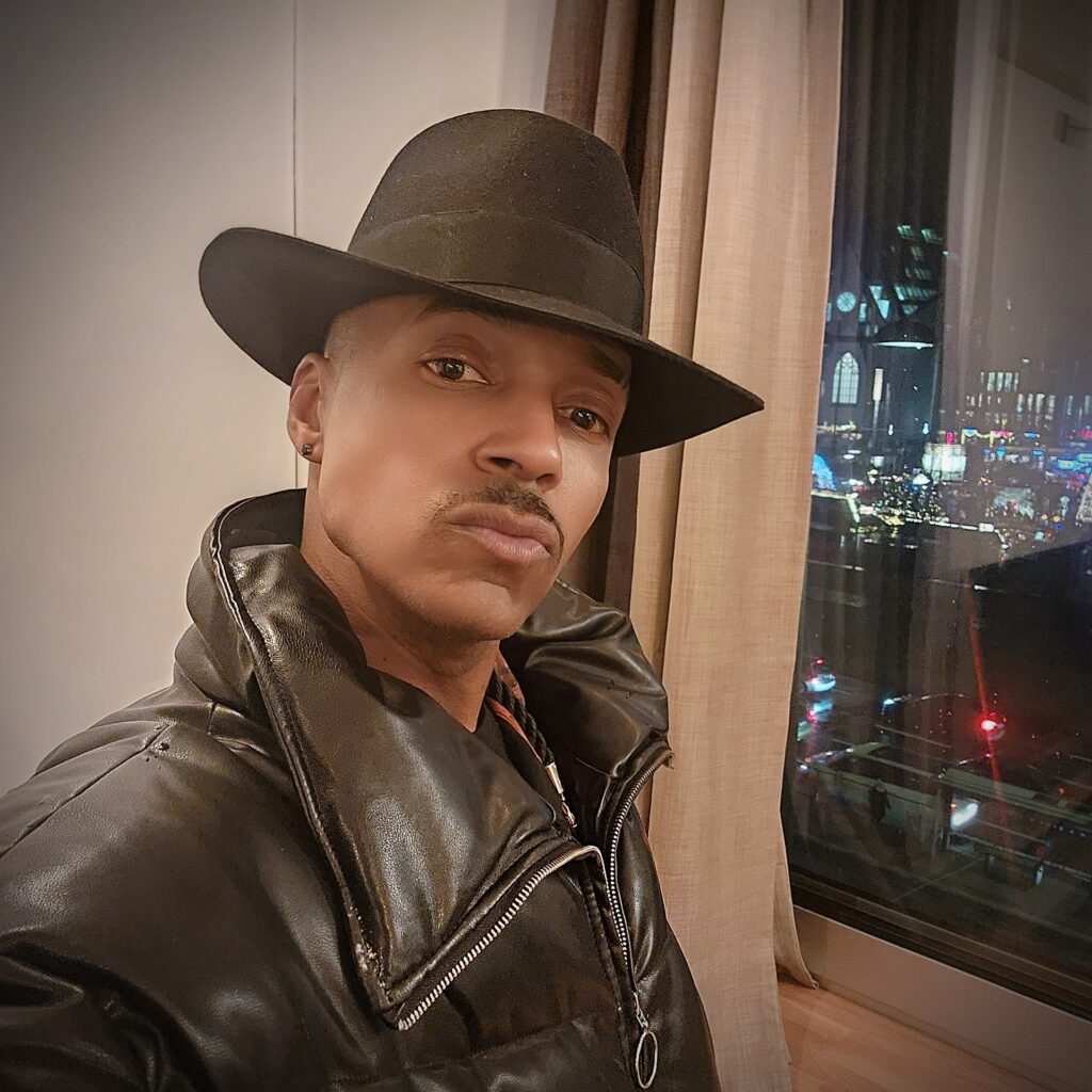 Vaughn Lowery tries on a fedora fabricated by a family business in Leipzig via 360 MAGAZINE.