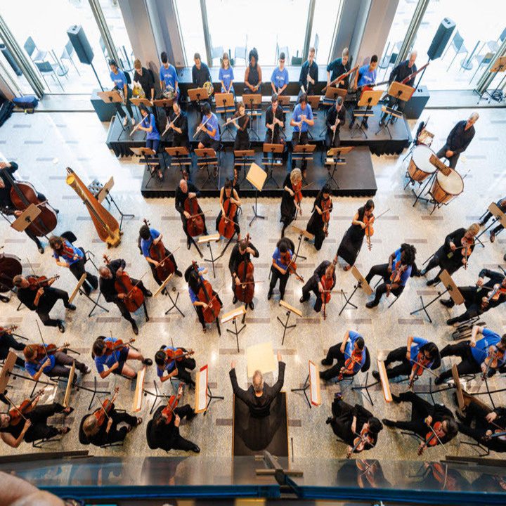 People practicing their musical instruments for the festival event.