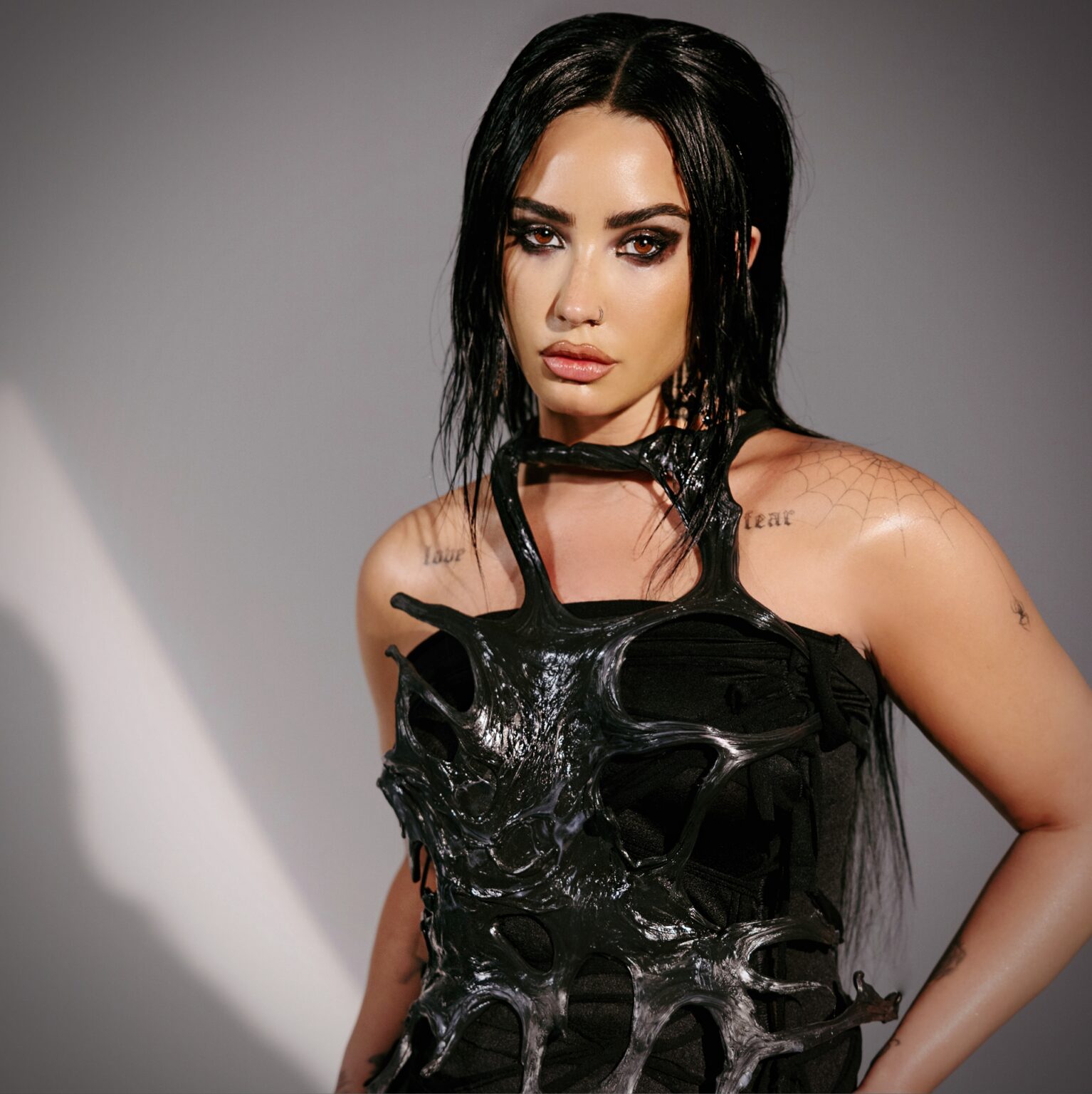 Demi Lovato and LE SSERAFIM via 360 MAGAZINE.