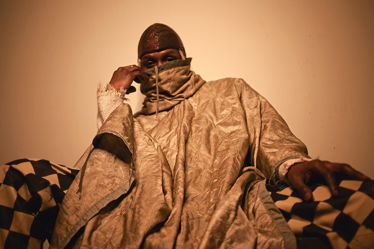 Creative Armon Hayes wears Navajo art brand 4kinship captured by celebrity photographer Vaughn Lowery for 360 MAGAZINE at the Bronx Bodega 4470.