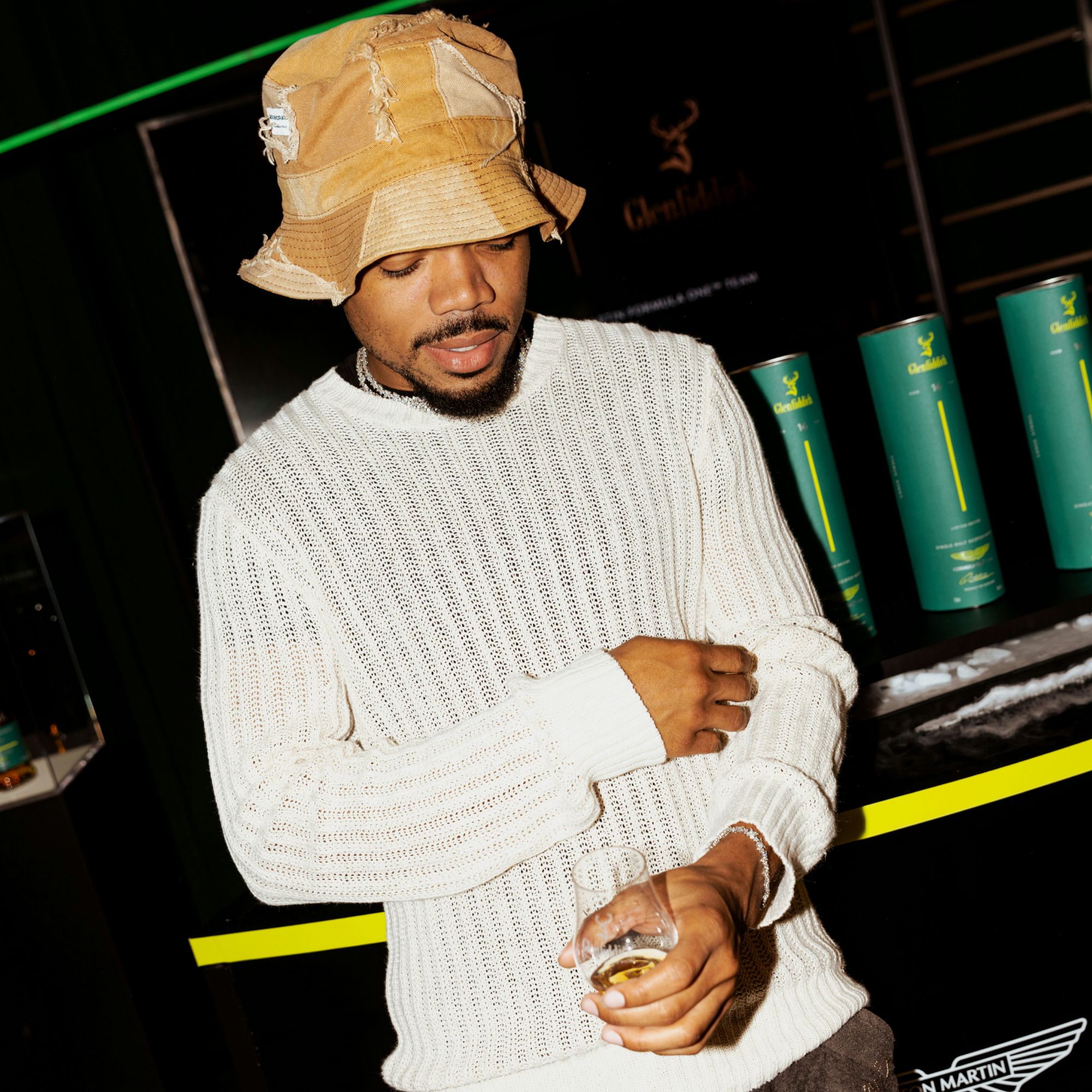 PHOTO of chance the rapper from Aston Martin Formula One™ Team x Glenfiddich Grand Central Activation + VIP Reception via Vaughn Lowery's 360 Magazine. 