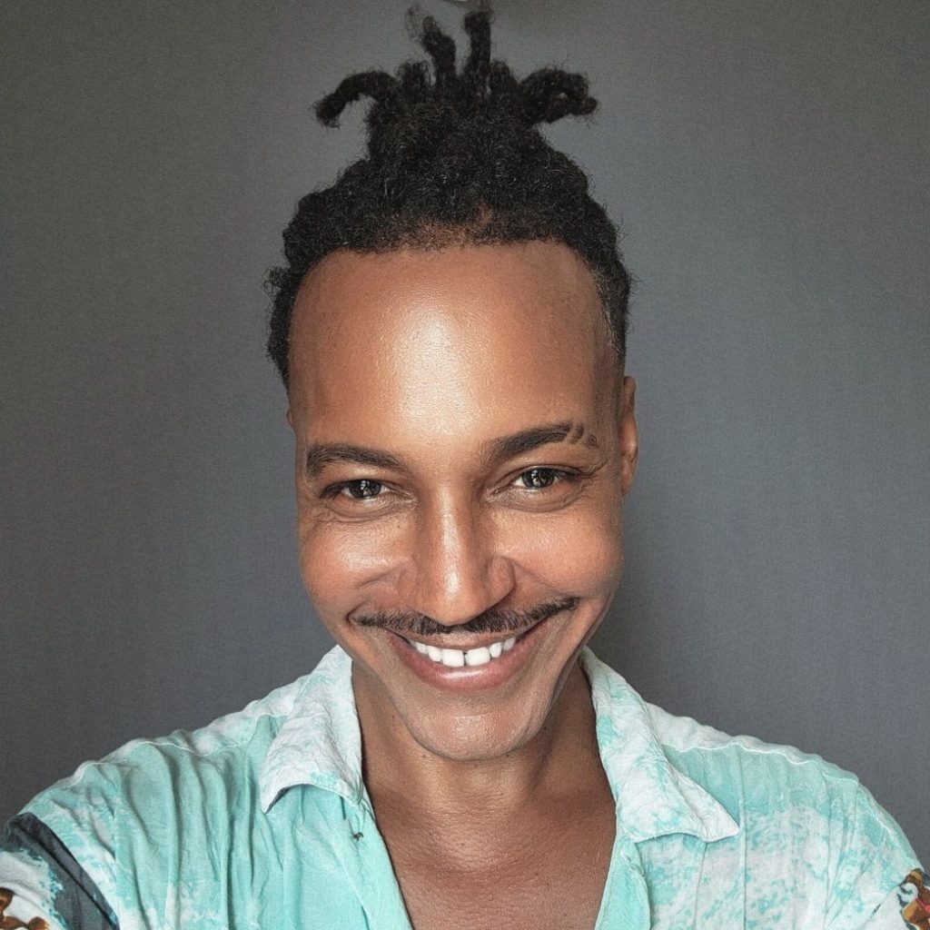 Celebrity, top model, photographer, actor, and editor Vaughn Lowery in Phnom Penh Cambodia completing his mixed media art collection called Chroy Changvar via 360 MAGAZINE.