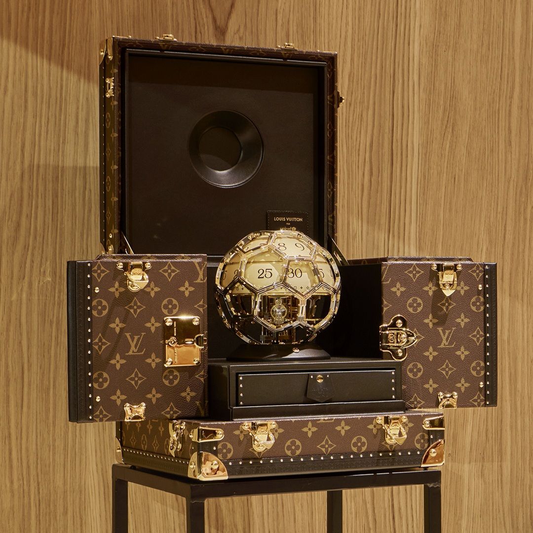 Louis Vuitton and UNICEF partnership trunk, soccer ball, locket via 360 MAGAZINE.